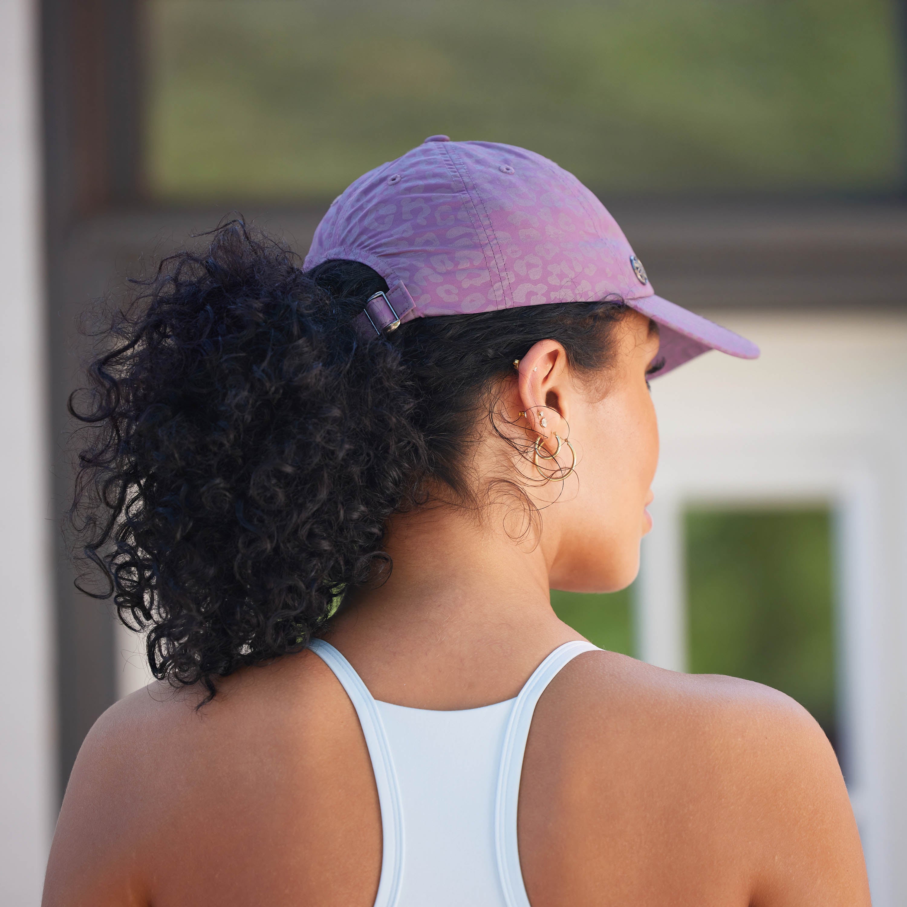 Back view of the Classic Leopard Print Hat to show the ponytail ability